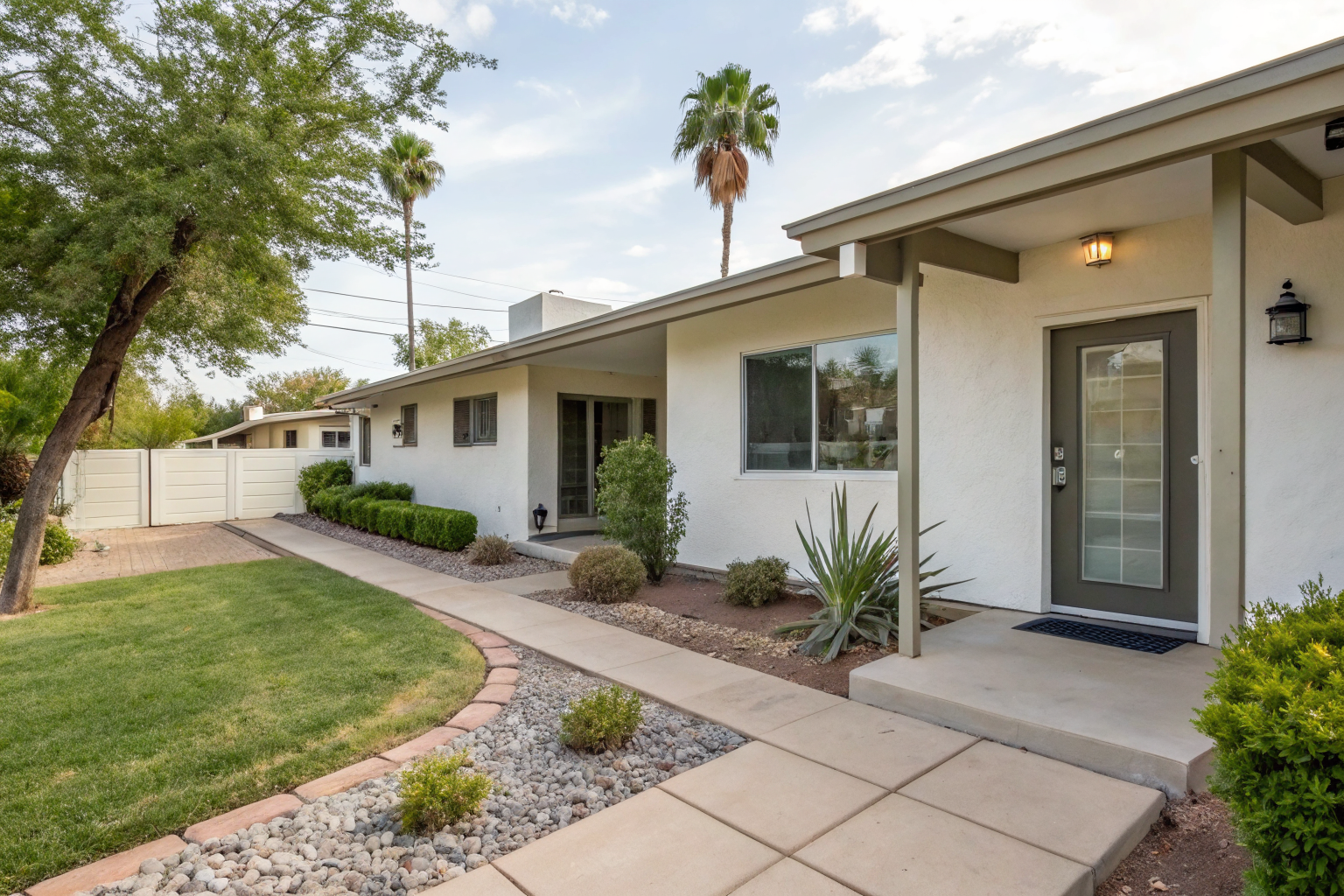 Short-term rental in Tempe with Airbnb welcome sign outside.