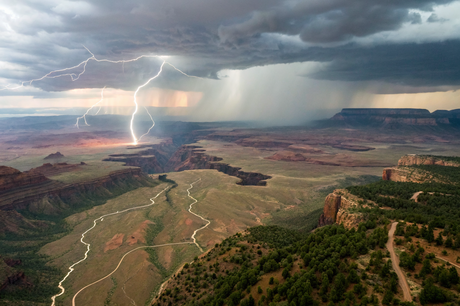 Isometric view of landscape with weather events and trigger mechanisms.