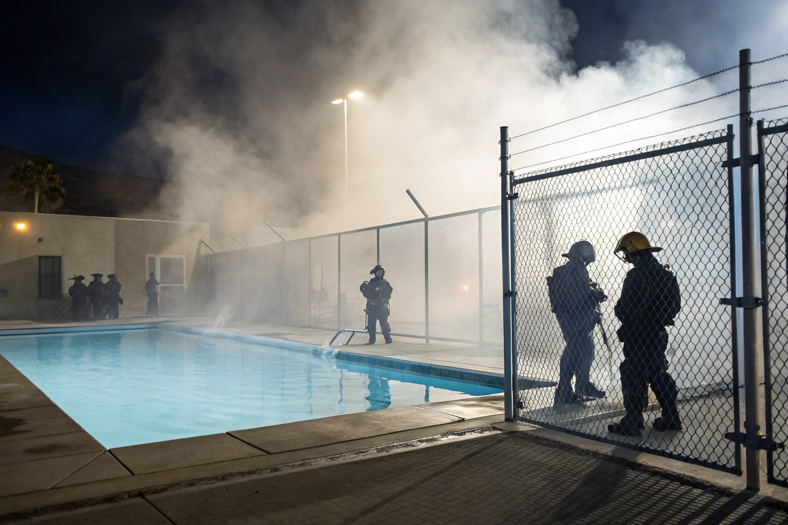 An epic depiction of pool safety barriers as legal shields in Arizona, with self-closing gates and latch specifications.