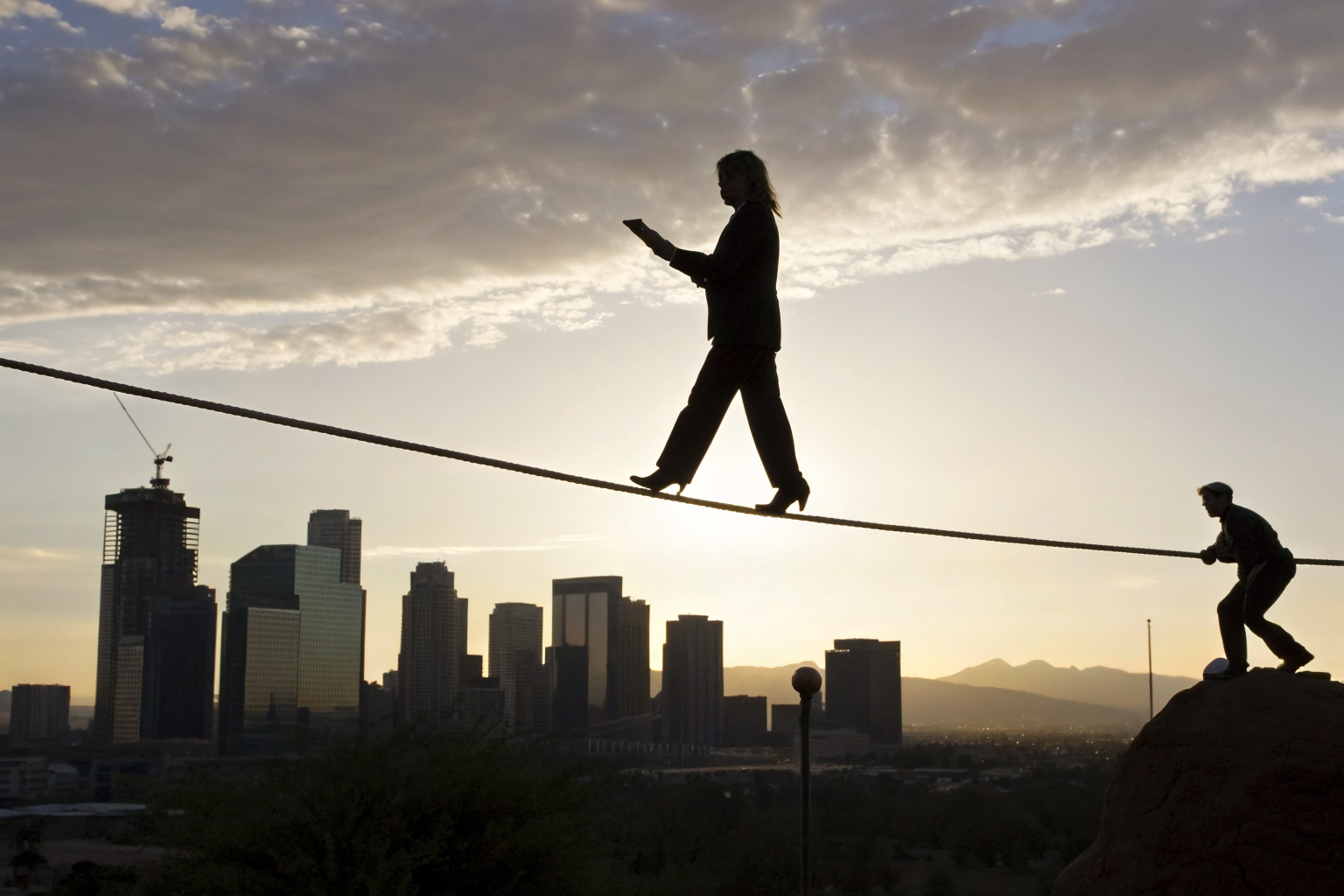 Tightrope metaphor illustrating balance between STR legal compliance and freedom.