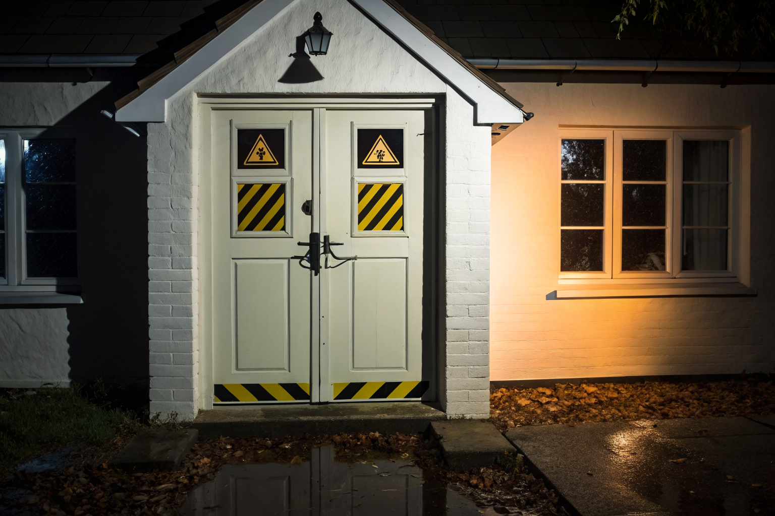 Locked door with warning signs symbolizing insurance policy exclusions.